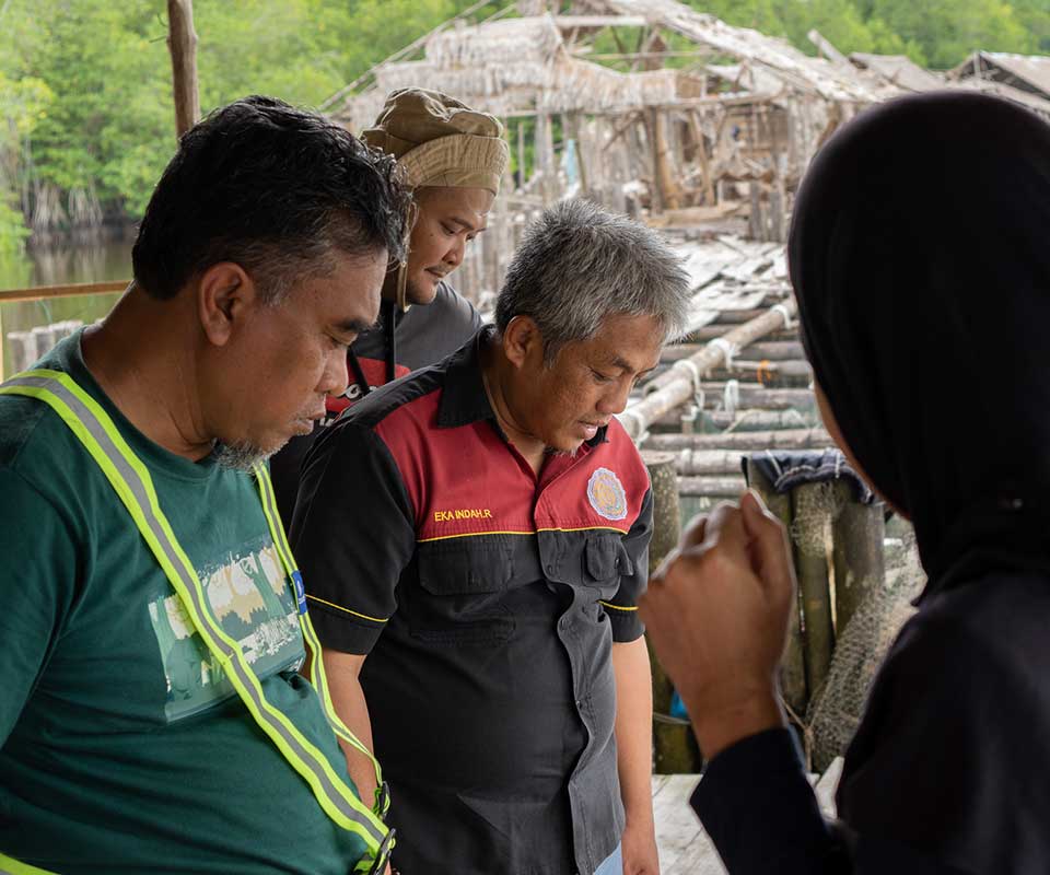 Representatives of PT Kandelia Alam, together with an expert from Universitas Muhammadiyah Pontianak, visiting the mangrove crab and tapered fish cultivation research site